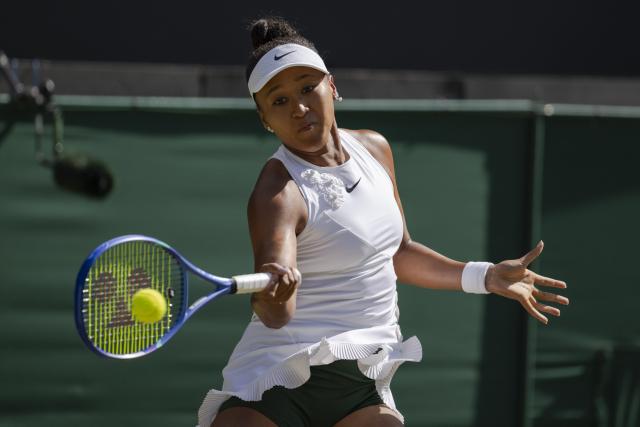 (260708) -- LONDON, July 8, 2026 (Xinhua) -- Osaka Naomi hits a return during the women's singles quarterfinal between Karolina Muchova of the Czech Republic and Osaka Naomi of Japan at the Wimbledon Tennis Championships in London, Britain, on July 7, 2026. (Photo by Stephen Chung/Xinhua)