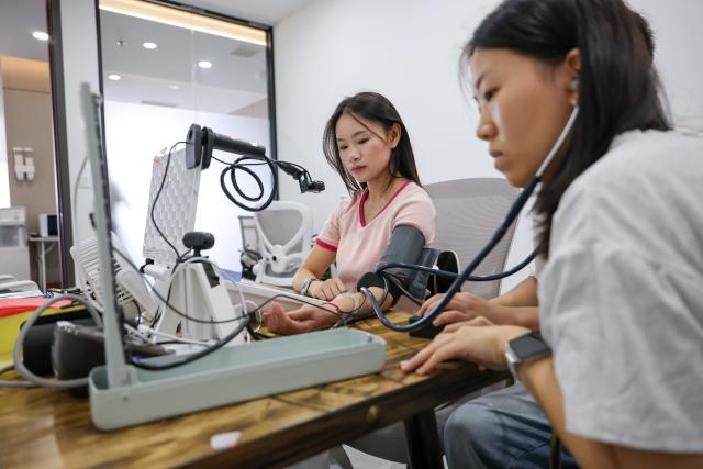 (260708) -- GUIYANG, July 8, 2026 (Xinhua) -- A data collector captures data for a medical smart wearable device at a data collection company in Yunyan District of Guiyang City, southwest China's Guizhou Province, July 6, 2026. With the rapid development of embodied artificial intelligence (AI), a new profession, trainers of embodied AI, has emerged, which comprise roles such as data collectors.
   In Guizhou, China's first national comprehensive big data pilot zone, data collectors are producing the essential "raw material" for the digital economy, bridging the physical and digital worlds.
   Data collection professionals show a rising demand in recent years, becoming an emerging career path in digital job market. (Xinhua/Liu Xu)