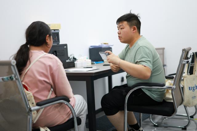 (260708) -- GUIYANG, July 8, 2026 (Xinhua) -- A data collector inquires a user of medical smart wearable device at a data collection company in Yunyan District of Guiyang City, southwest China's Guizhou Province, July 6, 2026. With the rapid development of embodied artificial intelligence (AI), a new profession, trainers of embodied AI, has emerged, which comprise roles such as data collectors.
   In Guizhou, China's first national comprehensive big data pilot zone, data collectors are producing the essential "raw material" for the digital economy, bridging the physical and digital worlds.
   Data collection professionals show a rising demand in recent years, becoming an emerging career path in digital job market. (Xinhua/Liu Xu)