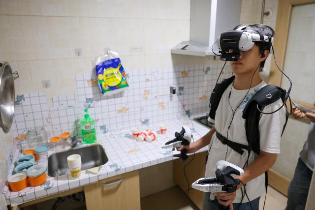 (260708) -- GUIYANG, July 8, 2026 (Xinhua) -- A data collector captures real-world inputs for embodied intelligent devices at a kitchen scenario in Nanming District of Guiyang City, southwest China's Guizhou Province, July 6, 2026. With the rapid development of embodied artificial intelligence (AI), a new profession, trainers of embodied AI, has emerged, which comprise roles such as data collectors.
   In Guizhou, China's first national comprehensive big data pilot zone, data collectors are producing the essential "raw material" for the digital economy, bridging the physical and digital worlds.
   Data collection professionals show a rising demand in recent years, becoming an emerging career path in digital job market. (Xinhua/Liu Xu)