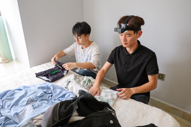 (260708) -- GUIYANG, July 8, 2026 (Xinhua) -- Data collectors capture real-world inputs for embodied intelligent devices at a home scenario in Nanming District of Guiyang City, southwest China's Guizhou Province, July 6, 2026. With the rapid development of embodied artificial intelligence (AI), a new profession, trainers of embodied AI, has emerged, which comprise roles such as data collectors.
   In Guizhou, China's first national comprehensive big data pilot zone, data collectors are producing the essential "raw material" for the digital economy, bridging the physical and digital worlds.
   Data collection professionals show a rising demand in recent years, becoming an emerging career path in digital job market. (Xinhua/Liu Xu)