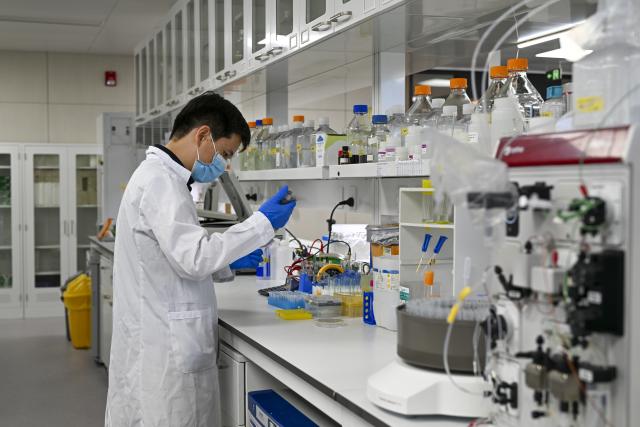 (260708) -- SHANGHAI, July 8, 2026 (Xinhua) -- A researcher conducts an experiment at a laboratory of Interdisciplinary Research Center on Biology and Chemistry under the Chinese Academy of Sciences (CAS) in Shanghai, east China, July 6, 2026. Basic research is the foundation of all scientific and technological innovation. In recent years, the CAS Shanghai Branch has worked closely with Shanghai to foster basic research. It also provides stable support for young researchers, creating an environment where long-term scientific exploration can generate breakthroughs that serve national priorities and advance cutting-edge research. (Xinhua/Chen Shuo)