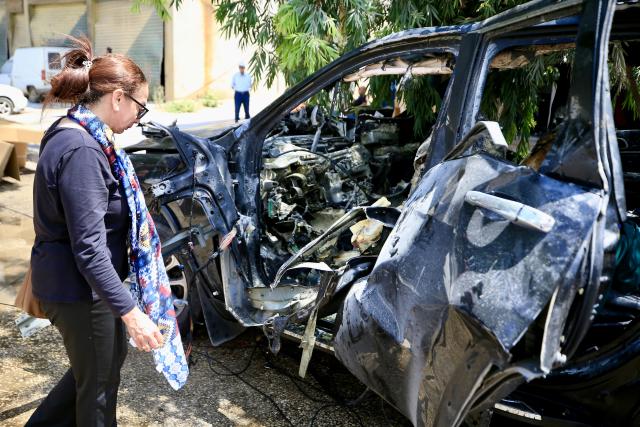 (260708) -- NABATIEH AL-FAWQA, July 8, 2026 (Xinhua) -- A relative of the victim is seen at the site of an Israeli drone strike in Nabatieh al-Fawqa, southern Lebanon, July 7, 2026. Four people were killed on Monday during an Israeli drone strike on a vehicle in the town of Nabatieh al-Fawqa in southern Lebanon, Lebanon's state-run National News Agency (NNA) reported. (Photo by Ali Hashisho/Xinhua)