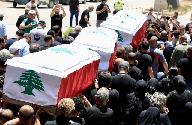 (260708) -- NABATIEH AL-FAWQA, July 8, 2026 (Xinhua) -- People participate in a mass funeral for victims killed by an Israeli drone strike in Nabatieh al-Fawqa, southern Lebanon, July 7, 2026. Four people were killed on Monday during an Israeli drone strike on a vehicle in the town of Nabatieh al-Fawqa in southern Lebanon, Lebanon's state-run National News Agency (NNA) reported. (Photo by Ali Hashisho/Xinhua)