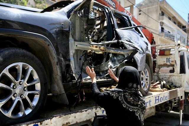 (260708) -- NABATIEH AL-FAWQA, July 8, 2026 (Xinhua) -- A relative of the victim is seen at the site of an Israeli drone strike in Nabatieh al-Fawqa, southern Lebanon, July 7, 2026. Four people were killed on Monday during an Israeli drone strike on a vehicle in the town of Nabatieh al-Fawqa in southern Lebanon, Lebanon's state-run National News Agency (NNA) reported. (Photo by Ali Hashisho/Xinhua)