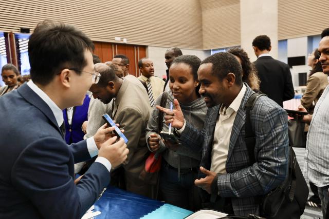 (260708) -- ADDIS ABABA, July 8, 2026 (Xinhua) -- Guests learn about smart electronic devices after attending a conference to promote the 140th Canton Fair at the African Union (AU) headquarters in Addis Ababa, Ethiopia, July 7, 2026. Officials from China and the AU have emphasized the significance of the China Import and Export Fair, also known as the Canton Fair, in connecting African businesses with global buyers, investors, technology partners, and new commercial opportunities.
   TO GO WITH "Canton Fair promoted at AU to connect African businesses with global buyers" (Xinhua/Geng Xinning)