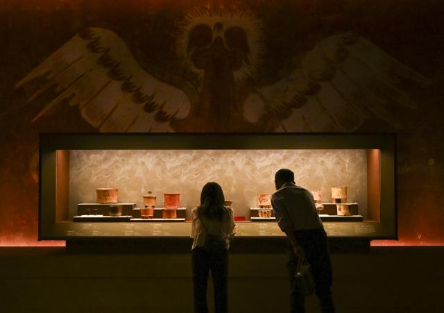 (260708) -- SHANGHAI, July 8, 2026 (Xinhua) -- Visitors view exhibits during the exhibition "On Top of the World Tree: Ancient Civilizations of the Americas" in Shanghai, east China, July 8, 2026. The exhibition showcases a total of 1,129 sets of precious artifacts from cultural institutions in Mexico, Peru and China. It will officially open to the public on July 9 and will run until Nov. 14, 2027. (Xinhua/Chen Haoming)
