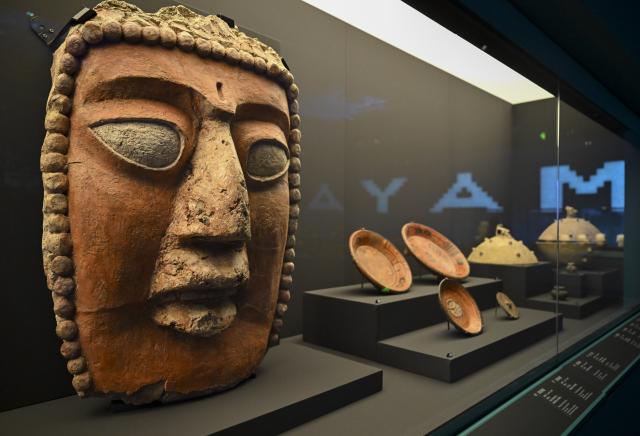 (260708) -- SHANGHAI, July 8, 2026 (Xinhua) -- Exhibits are seen during the exhibition "On Top of the World Tree: Ancient Civilizations of the Americas" in Shanghai, east China, July 8, 2026. The exhibition showcases a total of 1,129 sets of precious artifacts from cultural institutions in Mexico, Peru and China. It will officially open to the public on July 9 and will run until Nov. 14, 2027. (Xinhua/Chen Haoming)