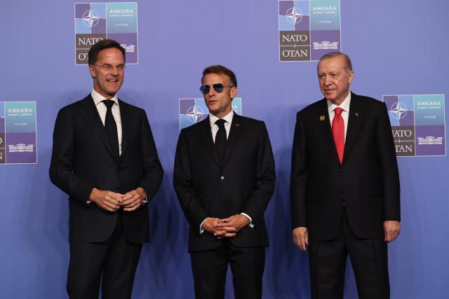 (260708) -- ANKARA, July 8, 2026 (Xinhua) -- NATO Secretary General Mark Rutte (L), Turkish President Recep Tayyip Erdogan (R) and French President Emmanuel Macron pose for photos at the 2026 NATO Summit in Ankara, Türkiye, on July 8, 2026. (Mustafa Kaya/Handout via Xinhua)