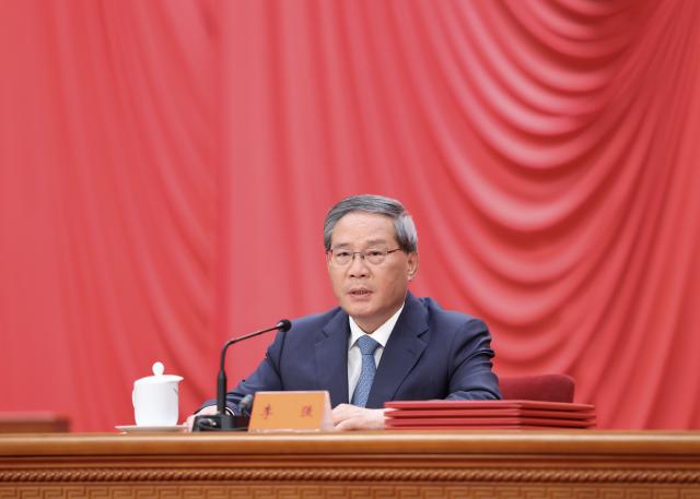 (260708) -- BEIJING, July 8, 2026 (Xinhua) -- Li Qiang presides over a meeting bringing together the national science and technology award conference, the general assemblies of the members of the Chinese Academy of Sciences (CAS) and the Chinese Academy of Engineering (CAE), and the 11th national congress of the China Association for Science and Technology at the Great Hall of the People in Beijing, capital of China, July 8, 2026. (Xinhua/Huang Jingwen)