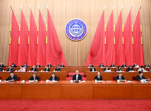 (260708) -- BEIJING, July 8, 2026 (Xinhua) -- Cai Qi, a member of the Standing Committee of the Political Bureau of the Communist Party of China (CPC) Central Committee and a member of the Secretariat of the CPC Central Committee, addresses the second plenary session of the 11th national congress of the China Association for Science and Technology at the Great Hall of the People in Beijing, capital of China, July 8, 2026. Cai called on the country's sci-tech workers to stay committed to serving the country through sci-tech innovation and embrace the mission of achieving greater sci-tech self-reliance and strength. (Xinhua/Li Xiang)