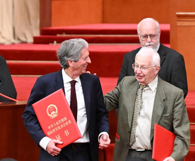 (260708) -- BEIJING, July 8, 2026 (Xinhua) -- Winners of the China International Science and Technology Cooperation Award for the year 2025 are pictured at a meeting bringing together the national science and technology award conference, the general assemblies of the members of the Chinese Academy of Sciences (CAS) and the Chinese Academy of Engineering (CAE), and the 11th national congress of the China Association for Science and Technology at the Great Hall of the People in Beijing, capital of China, July 8, 2026. (Xinhua/Shen Hong)