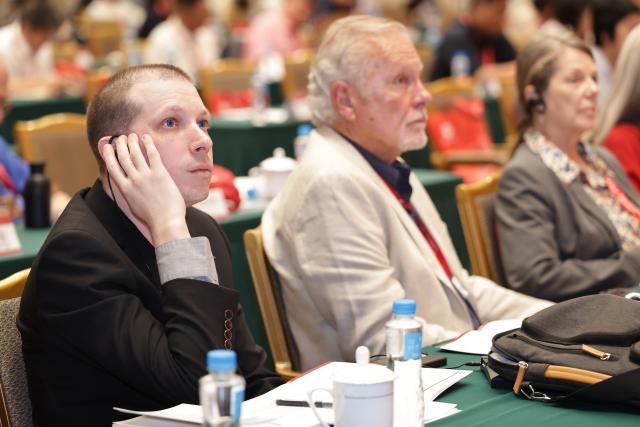 (260708) -- BEIJING, July 8, 2026 (Xinhua) -- Guests attend an international symposium at Peking University (PKU) in Beijing, capital of China, July 8, 2026. An international symposium themed on "Legacy of Edgar Snow: International Symposium on Contemporary Value and Inspiration to the World" kicked off here on Tuesday. (Xinhua/Zhang Yuwei)