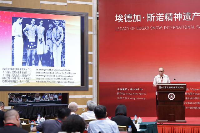(260708) -- BEIJING, July 8, 2026 (Xinhua) -- Michael Crook, chairman of the International Committee for the Promotion of Chinese Industrial Cooperatives, speaks at an international symposium at Peking University (PKU) in Beijing, capital of China, July 8, 2026. An international symposium themed on "Legacy of Edgar Snow: International Symposium on Contemporary Value and Inspiration to the World" kicked off here on Tuesday. (Xinhua/Zhang Yuwei)
