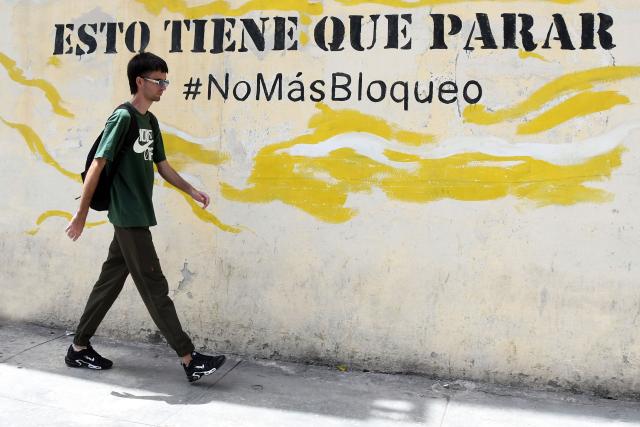 (260708) -- HAVANA, July 8, 2026 (Xinhua) -- A man walks past a slogan opposing the U.S. blockade, in Havana, capital of Cuba, on July 8, 2026. Cuban Foreign Minister Bruno Rodriguez on Tuesday accused the U.S. government of carrying out "multidimensional, non-conventional warfare" against Cuba, which he said has lasted for almost seven decades and "become ever crueler and more ruthless during the last seven months."
The cumulative damage caused by the U.S. blockade since it was first imposed amounts to 178.7 billion U.S. dollars at current prices, according to Rodriguez. (Photo by Joaquin Hernandez/Xinhua)