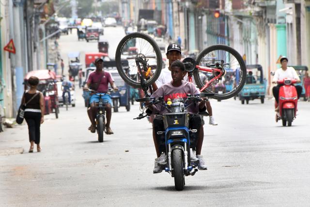 (260708) -- HAVANA, July 8, 2026 (Xinhua) -- People drive on a street in Havana, capital of Cuba, on July 8, 2026. Cuban Foreign Minister Bruno Rodriguez on Tuesday accused the U.S. government of carrying out "multidimensional, non-conventional warfare" against Cuba, which he said has lasted for almost seven decades and "become ever crueler and more ruthless during the last seven months."
The cumulative damage caused by the U.S. blockade since it was first imposed amounts to 178.7 billion U.S. dollars at current prices, according to Rodriguez. (Photo by Joaquin Hernandez/Xinhua)