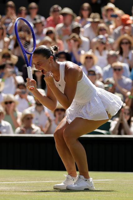 (260709) -- LONDON, July 9, 2026 (Xinhua) -- Marta Kostyuk of Ukraine celebrates after winning the women's singles quarterfinal match against Jasmine Paolini of Itlay at the Wimbledon Tennis Championships in London, Britain, on July 8, 2026. (Photo by Dinendra Haria/Xinhua)