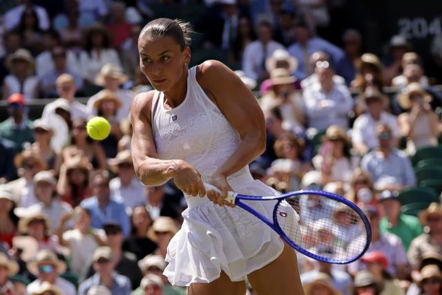 (260709) -- LONDON, July 9, 2026 (Xinhua) -- Marta Kostyuk of Ukraine returns the ball during the women's singles quarterfinal match against Jasmine Paolini of Itlay at the Wimbledon Tennis Championships in London, Britain, on July 8, 2026. (Photo by Dinendra Haria/Xinhua)