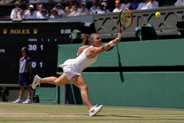 (260709) -- LONDON, July 9, 2026 (Xinhua) -- Jasmine Paolini of Itlay returns the ball during the women's singles quarterfinal match against Marta Kostyuk of Ukraine at the Wimbledon Tennis Championships in London, Britain, on July 8, 2026. (Photo by Dinendra Haria/Xinhua)