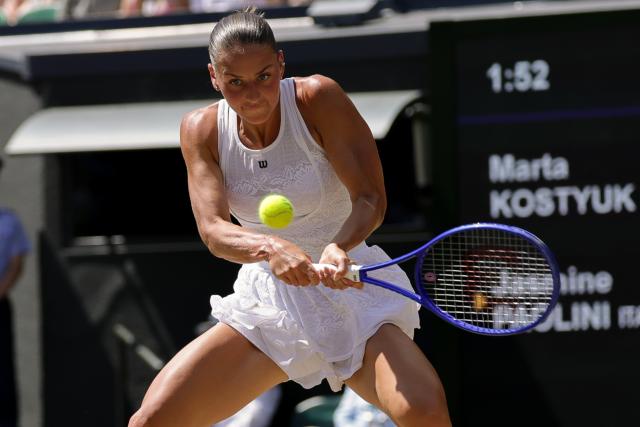(260709) -- LONDON, July 9, 2026 (Xinhua) -- Marta Kostyuk of Ukraine returns the ball during the women's singles quarterfinal match against Jasmine Paolini of Itlay at the Wimbledon Tennis Championships in London, Britain, on July 8, 2026. (Photo by Dinendra Haria/Xinhua)