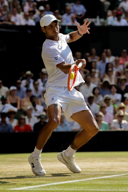 (260709) -- LONDON, July 9, 2026 (Xinhua) -- Flavio Cobolli of Itlay returns the ball during the men's singles quarterfinal match against Arthur Fery of Britain at the Wimbledon Tennis Championships in London, Britain, on July 8, 2026. (Photo by Dinendra Haria/Xinhua)