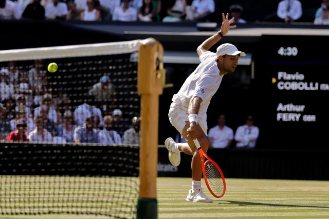 (260709) -- LONDON, July 9, 2026 (Xinhua) -- Flavio Cobolli of Itlay returns the ball during the men's singles quarterfinal match against Arthur Fery of Britain at the Wimbledon Tennis Championships in London, Britain, on July 8, 2026. (Photo by Dinendra Haria/Xinhua)