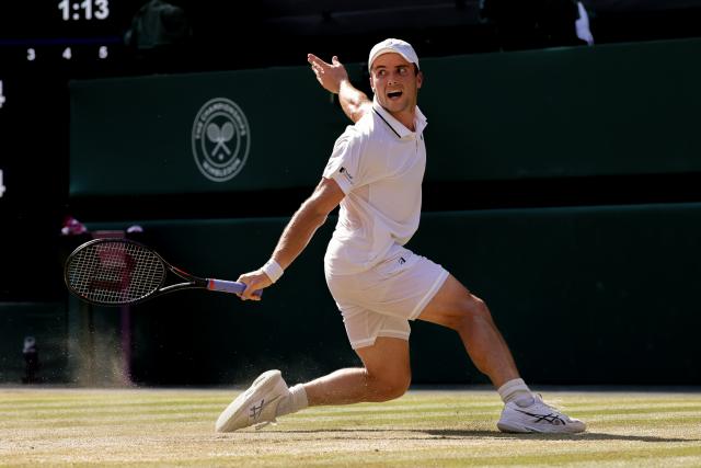 (260709) -- LONDON, July 9, 2026 (Xinhua) -- Arthur Fery of Britain returns the ball during the men's singles quarterfinal match against Flavio Cobolli of Itlay at the Wimbledon Tennis Championships in London, Britain, on July 8, 2026. (Photo by Dinendra Haria/Xinhua)