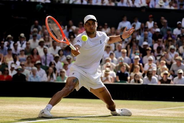 (260709) -- LONDON, July 9, 2026 (Xinhua) -- Flavio Cobolli of Itlay returns the ball during the men's singles quarterfinal match against Arthur Fery of Britain at the Wimbledon Tennis Championships in London, Britain, on July 8, 2026. (Photo by Dinendra Haria/Xinhua)