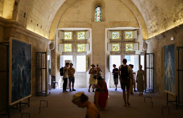 (260709) -- ARLES, July 9, 2026 (Xinhua) -- People view exhibits during an exhibition at the Rencontres d'Arles photography festival in Arles, France, July 8, 2026. The 57th Rencontres d'Arles photography festival lasts from July 6 to October 4. (Xinhua/Wu Huiwo)
