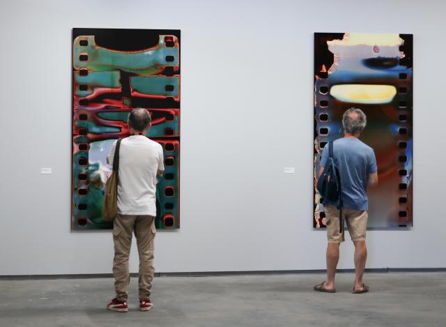 (260709) -- ARLES, July 9, 2026 (Xinhua) -- People view exhibits during an exhibition at the Rencontres d'Arles photography festival in Arles, France, July 8, 2026. The 57th Rencontres d'Arles photography festival lasts from July 6 to October 4. (Xinhua/Wu Huiwo)