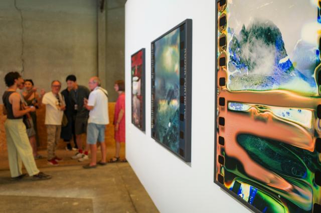 (260709) -- ARLES, July 9, 2026 (Xinhua) -- People visit an exhibition at the Rencontres d'Arles photography festival in Arles, France, July 8, 2026. The 57th Rencontres d'Arles photography festival lasts from July 6 to October 4. (Xinhua/Wu Huiwo)