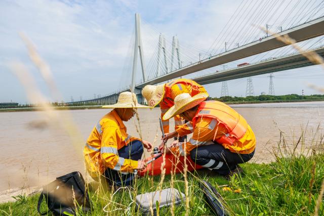 (260709) -- HANGZHOU, July 9, 2026 (Xinhua) -- Railway workers prepare to inspect a railway bridge with an unmanned vessel in Ningbo City, east China's Zhejiang Province, July 9, 2026. China's State Flood Control and Drought Relief Headquarters on Wednesday activated a Level-IV emergency response for flood control and typhoon prevention in the provinces of Zhejiang and Fujian, the Ministry of Emergency Management said.
   Super Typhoon Bavi is forecast to move westward before turning northwestward at a speed of around 15 to 20 km per hour, and may make landfall along the coast between Fuqing in Fujian Province and Wenling in Zhejiang Province on Saturday night, as either a strong typhoon or a typhoon. (Xinhua/Jiang Han)