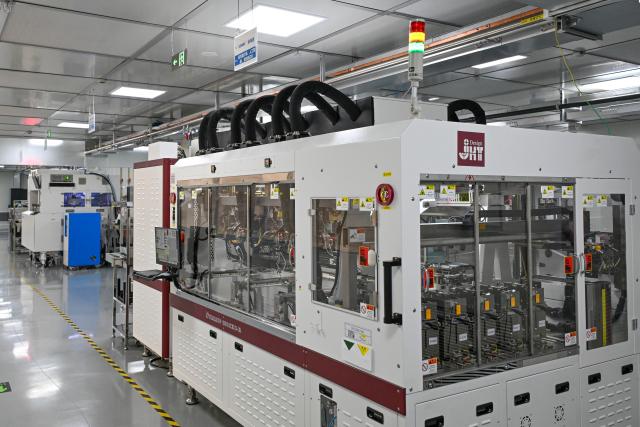 (260709) -- SHANGHAI, July 9, 2026 (Xinhua) -- This photo taken on July 8, 2026 shows facilities at a testing workshop of a chips testing service platform at the Zhangjiang Hi-Tech 895 Incubator in Pudong New Area, east China's Shanghai. Located in Shanghai's Pudong New Area, the Zhangjiang Hi-Tech 895 Incubator, a specialized entrepreneurship service platform, has incubated more than 1,600 innovative enterprises since its establishment in 2015. 
   Equipped with advanced testing facilities, including a 4,000-square-meter clean test workshop, the incubator provides one-stop public testing services and shared office space for startups. Its testing platform supports the development of high-performance computing chips, large-scale System-on-a-Chip (SoC), memory chips, sensor chips and mixed-signal chips, helping technology startups reduce costs and accelerate innovation. (Xinhua/Chen Shuo)