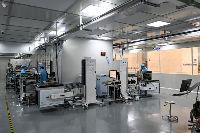 (260709) -- SHANGHAI, July 9, 2026 (Xinhua) -- This photo taken on July 8, 2026 shows a testing workshop of a chips testing service platform at the Zhangjiang Hi-Tech 895 Incubator in Pudong New Area, east China's Shanghai. Located in Shanghai's Pudong New Area, the Zhangjiang Hi-Tech 895 Incubator, a specialized entrepreneurship service platform, has incubated more than 1,600 innovative enterprises since its establishment in 2015. 
   Equipped with advanced testing facilities, including a 4,000-square-meter clean test workshop, the incubator provides one-stop public testing services and shared office space for startups. Its testing platform supports the development of high-performance computing chips, large-scale System-on-a-Chip (SoC), memory chips, sensor chips and mixed-signal chips, helping technology startups reduce costs and accelerate innovation. (Xinhua/Chen Shuo)