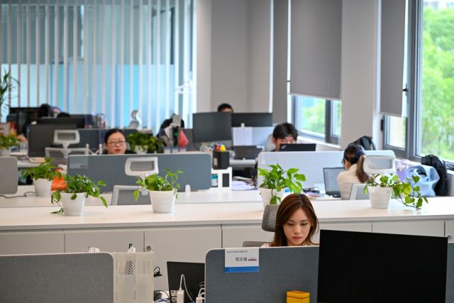 (260709) -- SHANGHAI, July 9, 2026 (Xinhua) -- R&D personnel work at a shared office space of a chips testing service platform at the Zhangjiang Hi-Tech 895 Incubator in Pudong New Area, east China's Shanghai, on July 8, 2026. Located in Shanghai's Pudong New Area, the Zhangjiang Hi-Tech 895 Incubator, a specialized entrepreneurship service platform, has incubated more than 1,600 innovative enterprises since its establishment in 2015. 
   Equipped with advanced testing facilities, including a 4,000-square-meter clean test workshop, the incubator provides one-stop public testing services and shared office space for startups. Its testing platform supports the development of high-performance computing chips, large-scale System-on-a-Chip (SoC), memory chips, sensor chips and mixed-signal chips, helping technology startups reduce costs and accelerate innovation. (Xinhua/Chen Shuo)