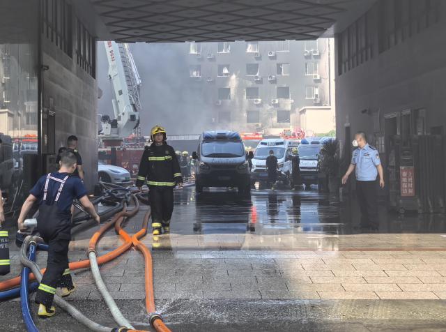 (260709) -- JINJIANG, July 9, 2026 (Xinhua) -- Rescue forces work after a fire broke out at a footwear factory in Jiangtou Village, Chendai Township of Jinjiang City, southeast China's Fujian Province, on July 9, 2026. A fire hit a footwear factory in Fujian, with several people reported trapped or missing, local authorities said Thursday. Firefighting was still underway, with multiple fire trucks and ambulances on standby at the scene.
China's Ministry of Emergency Management, together with the National Fire and Rescue Administration, has dispatched a joint work team to Jinjiang City to guide rescue and response efforts following the accident. (Xinhua/Zheng Liang)