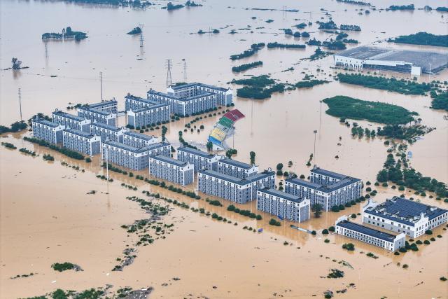 (260709) -- NANNING, July 9, 2026 (Xinhua) -- An aerial drone photo taken on July 8, 2026 shows the flooded Guangxi Logistics Vocational and Technical College in Guigang City, south China's Guangxi Zhuang Autonomous Region. Recent extreme rainstorms triggered by Typhoon Maysak, the 10th typhoon of the year, have caused severe flooding in parts of Guangxi in the Pearl River basin.
  Guangxi is continuing its search and rescue operations for missing persons, enhancing resettlement services for affected residents and advancing post-disaster reconstruction. (Xinhua/Zhou Hua)