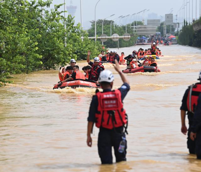 (260709) -- NANNING, July 9, 2026 (Xinhua) -- Rescuers evacuate trapped students in Guigang City, south China's Guangxi Zhuang Autonomous Region, July 9, 2026. Recent extreme rainstorms triggered by Typhoon Maysak, the 10th typhoon of the year, have caused severe flooding in parts of Guangxi in the Pearl River basin.
  Guangxi is continuing its search and rescue operations for missing persons, enhancing resettlement services for affected residents and advancing post-disaster reconstruction. (Xinhua/Cao Yiming)