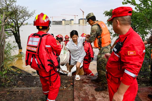 (260709) -- NANNING, July 9, 2026 (Xinhua) -- Rescuers evacuate trapped students in Guigang City, south China's Guangxi Zhuang Autonomous Region, July 9, 2026. Recent extreme rainstorms triggered by Typhoon Maysak, the 10th typhoon of the year, have caused severe flooding in parts of Guangxi in the Pearl River basin.
  Guangxi is continuing its search and rescue operations for missing persons, enhancing resettlement services for affected residents and advancing post-disaster reconstruction. (Xinhua/Cao Yiming)