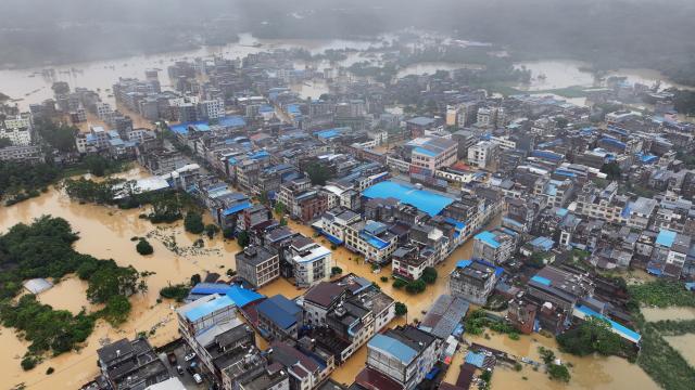(260709) -- NANNING, July 9, 2026 (Xinhua) -- An aerial drone photo taken on July 8, 2026 shows flooded Napeng Town of Qinnan District, Qinzhou City, south China's Guangxi Zhuang Autonomous Region. Recent extreme rainstorms triggered by Typhoon Maysak, the 10th typhoon of the year, have caused severe flooding in parts of Guangxi in the Pearl River basin.
  Guangxi is continuing its search and rescue operations for missing persons, enhancing resettlement services for affected residents and advancing post-disaster reconstruction. (Xinhua/Zhang Ailin)