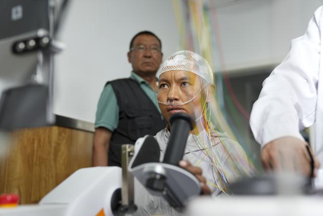 (260709) -- LHASA, July 9, 2026 (Xinhua) -- A patient with high paraplegia receives brain-computer interface (BCI) assisted neurorehabilitation treatment at Lhasa People's Hospital in Lhasa, southwest China's Xizang Autonomous Region, July 9, 2026. The first plateau BCI clinical application center in Xizang was officially inaugurated at Lhasa People's Hospital on Thursday, marking a significant step for the region in leveraging cutting-edge technology to address intractable neurological diseases.
 As a transformative human-computer interaction solution, BCI technology has shown great potential in the neurological rehabilitation field.
 This year, a medical assistance team from Beijing Tiantan Hospital to Xizang introduced the BCI technology to the region, which will promote the implementation of cutting-edge medical technologies to benefit people in Xizang. (Xinhua/Jigme Dorje)