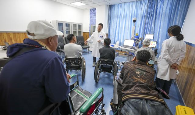 (260709) -- LHASA, July 9, 2026 (Xinhua) -- Patients watch a brain-computer interface (BCI) assisted neurorehabilitation treatment at Lhasa People's Hospital in Lhasa, southwest China's Xizang Autonomous Region, July 9, 2026. The first plateau BCI clinical application center in Xizang was officially inaugurated at Lhasa People's Hospital on Thursday, marking a significant step for the region in leveraging cutting-edge technology to address intractable neurological diseases.
 As a transformative human-computer interaction solution, BCI technology has shown great potential in the neurological rehabilitation field.
 This year, a medical assistance team from Beijing Tiantan Hospital to Xizang introduced the BCI technology to the region, which will promote the implementation of cutting-edge medical technologies to benefit people in Xizang. (Xinhua/Jigme Dorje)