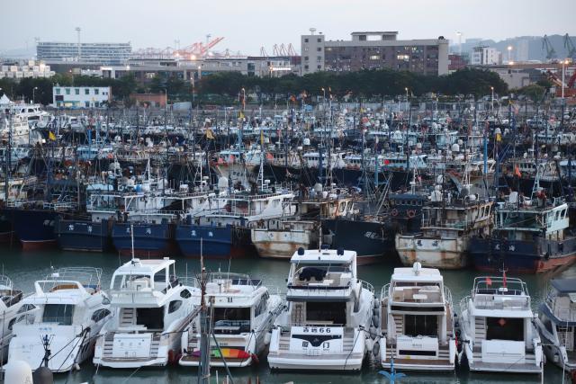 (260709) -- XIAMEN, July 9, 2026 (Xinhua) -- This photo taken on July 9, 2026 shows vessels taking shelter at a port in response to the incoming Typhoon Bavi in Xiamen, southeast China's Fujian Province. China's State Flood Control and Drought Relief Headquarters on Thursday upgraded its emergency response for flood and typhoon control from Level IV to Level III in response to Typhoon Bavi. (Photo by Zeng Demeng/Xinhua)