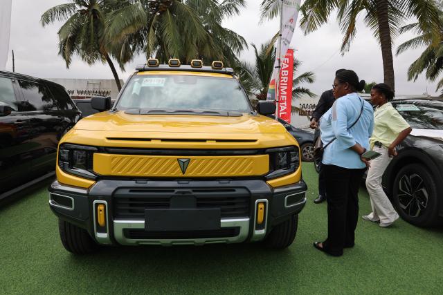 (260709) -- ACCRA, July 9, 2026 (Xinhua) -- Visitors view an electric vehicle at the three-day Ghana Investment and Trade Week and Africa Build Show in Accra, Ghana, July 8, 2026. TO GO WITH "Roundup: Chinese businesses explore opportunities at Ghana Investment and Trade Week" (Photo by Seth/Xinhua)