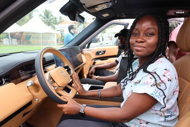 (260709) -- ACCRA, July 9, 2026 (Xinhua) -- A visitor sits in an electric vehicle at the three-day Ghana Investment and Trade Week and Africa Build Show in Accra, Ghana, July 8, 2026. TO GO WITH "Roundup: Chinese businesses explore opportunities at Ghana Investment and Trade Week" (Photo by Seth/Xinhua)