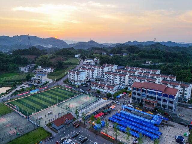 (260709) -- YIBIN, July 9, 2026 (Xinhua) -- An aerial drone photo taken on July 9, 2026 shows a temporary resettlement site for quake-affected people in Qunle Village of Gaoxian County, Yibin City, southwest China's Sichuan Province. A 5.0-magnitude earthquake jolted Gaoxian County, Yibin City, at 10:08 a.m. on Wednesday (Beijing Time), according to the China Earthquake Networks Center (CENC). Local authorities are making sustained efforts to ensure sound resettlement of quake-affected people. (Xinhua/Wang Xi)