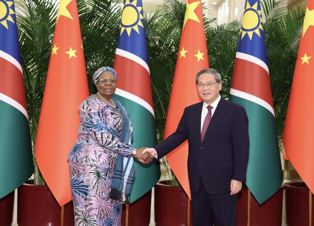 (260709) -- BEIJING, July 9, 2026 (Xinhua) -- Chinese Premier Li Qiang meets with Namibian President Netumbo Nandi-Ndaitwah, who is on a state visit to China, at the Great Hall of the People in Beijing, capital of China, July 9, 2026. (Xinhua/Huang Jingwen)