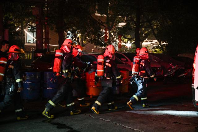 (260709) -- JINJIANG, July 9, 2026 (Xinhua) -- Firefighters work after a fire broke out at a shoe factory in Jiangtou Village, Chendai Township of Jinjiang City, southeast China's Fujian Province, on July 9, 2026. Twenty-eight people have been killed following a fire at a shoe factory in Jinjiang City on Thursday, local authorities said. (Xinhua/Zhou Yi)