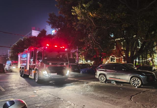 (260709) -- JINJIANG, July 9, 2026 (Xinhua) -- A fire truck is pictured after a fire broke out at a shoe factory in Jiangtou Village, Chendai Township of Jinjiang City, southeast China's Fujian Province, on July 9, 2026. Twenty-eight people have been killed following a fire at a shoe factory in Jinjiang City on Thursday, local authorities said. (Xinhua/Zhou Yi)