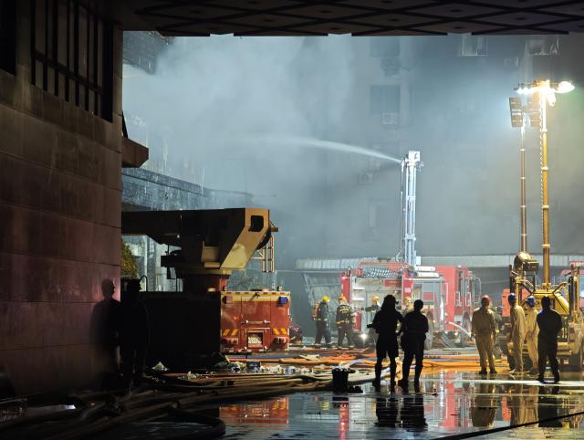 (260709) -- JINJIANG, July 9, 2026 (Xinhua) -- A fire truck works after a fire broke out at a shoe factory in Jiangtou Village, Chendai Township of Jinjiang City, southeast China's Fujian Province, on July 9, 2026. Twenty-eight people have been killed following a fire at a shoe factory in Jinjiang City on Thursday, local authorities said. (Xinhua/Zhou Yi)